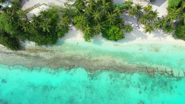 Wide angle aerial island view of a summer white paradise sand beach and turquoise sea background in 