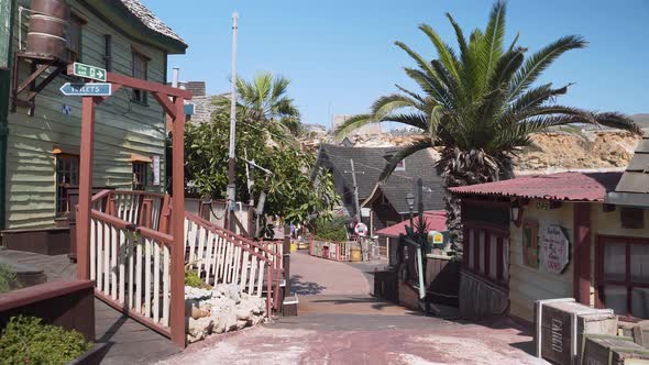 Colorful houses on a street of Popeye village theme park,palms,Malta.