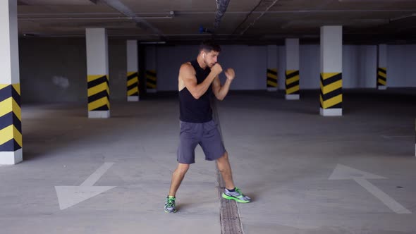 Boxer Does Training Punches in Underground Parking