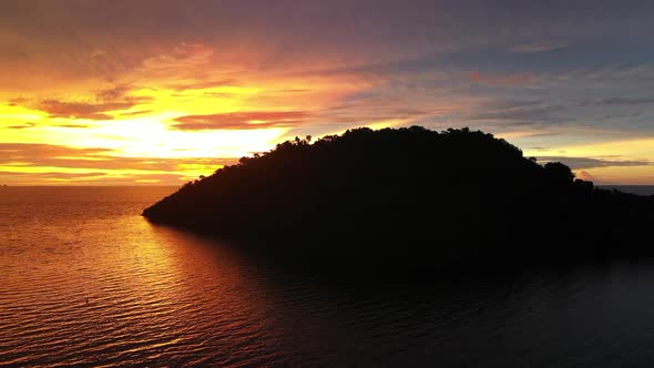 cinematic shot of a tropical island in the Indian Ocean near Madagascar at sunset