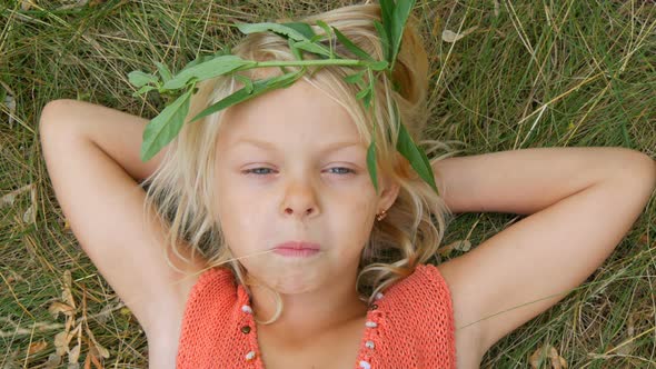 Cute Blueeyed Blonde Sevenyearold Girl with a Dirty Face