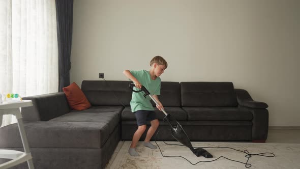 Nine Year Boy Having Fun While Cleaning