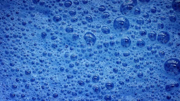 Blue Foam With Bubbles Popping