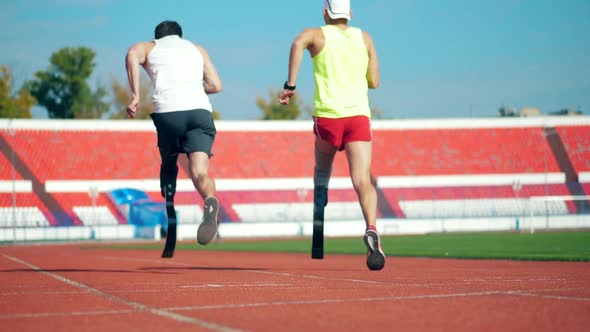 Paralympic Runners at the Stadium in Slow Motion