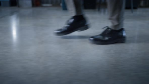 Storehouse Worker Legs Walking in Manufacture Storage Employee at Workplace