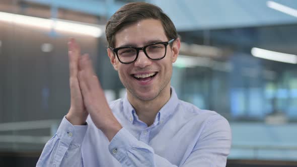 Portrait of Young Man Clapping Cheering