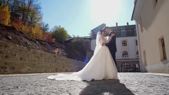 Wedding Couple Walks in the Old Town of Prague