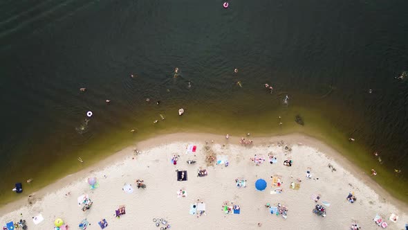 Aerial View From Drone on People Having a Rest on the River Bank in Summer