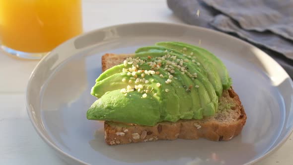 Avocado toast with hemp seeds. Vegan food concept. 
