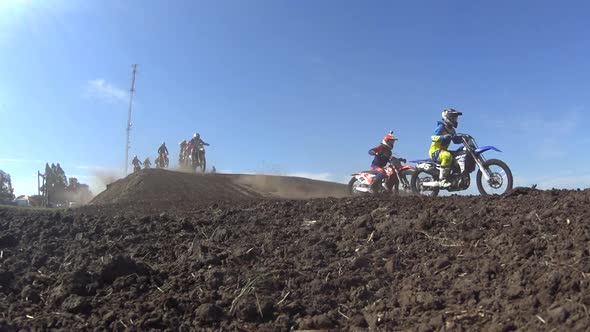 Men racing in a motocross motor sports race.