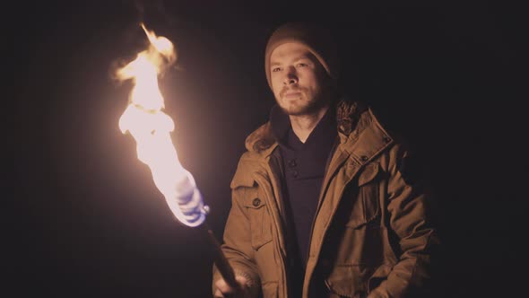 Scared Man with Fire Torch Lost in the Underground Ancient Vault