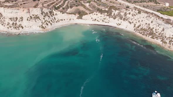 Aerial drone video from eastern Malta, Marsaxlokk area, Il-Hofra l-Kbira bay.