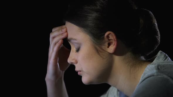 Young Woman Suffering Headache, Feeling Depression and Exhaustion, Closeup