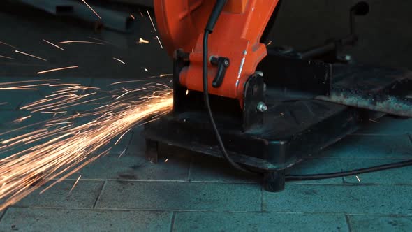 Professional Mechanic is Cutting Steel Metal