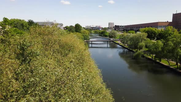 Drone Flies Over City River