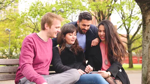 Group of friends having fun at park in Berlin