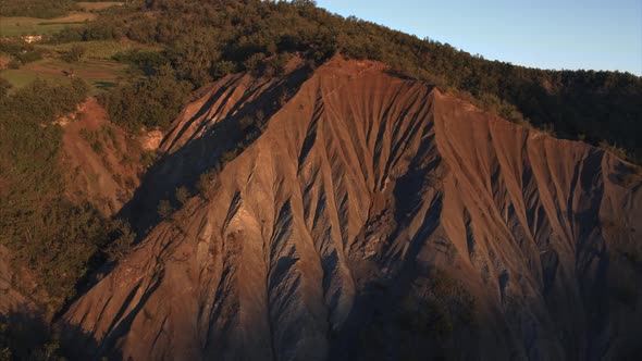 Aerial view of a beautiful ravine at dawn in Bettola, Emilia-Romagna, Italy.