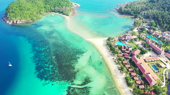 Luxury above abstract shot of a summer white paradise sand beach and blue water background in hi res