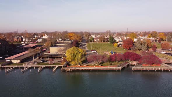 The Trenton City With Colorful Autumn Landscape Along Detroit River In Michigan, USA - Aerial Sidewa