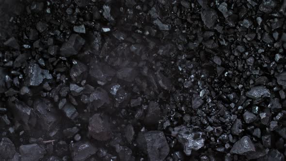 Super Slow Motion Shot of Crushing Coal on Black Background at 1000 Fps