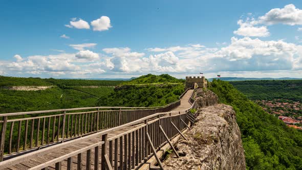 Time lapse with moving clouds over the medieval fortress