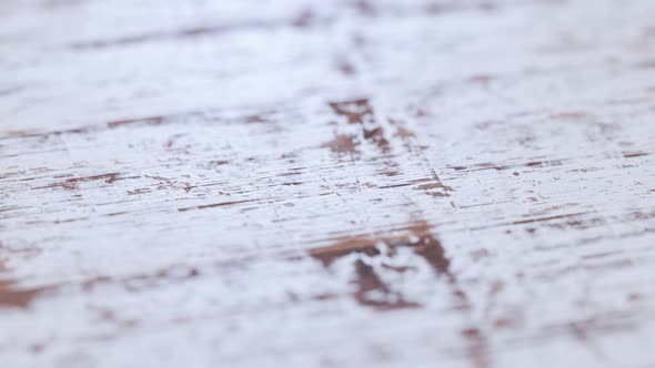 Old, grungy white painted wooden board or plank. Seamless looping animation.