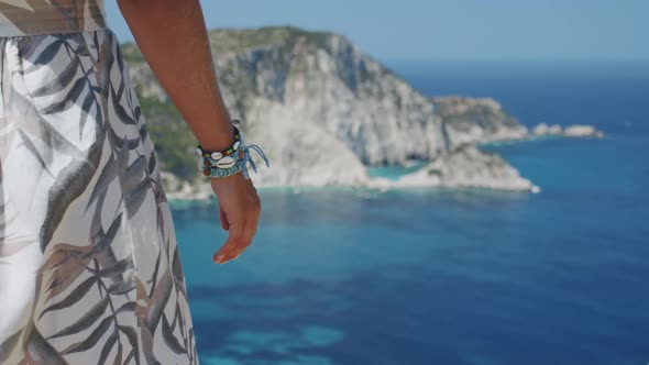 Woman Hand with Wristband Enjoying Vacation Travel Adventure