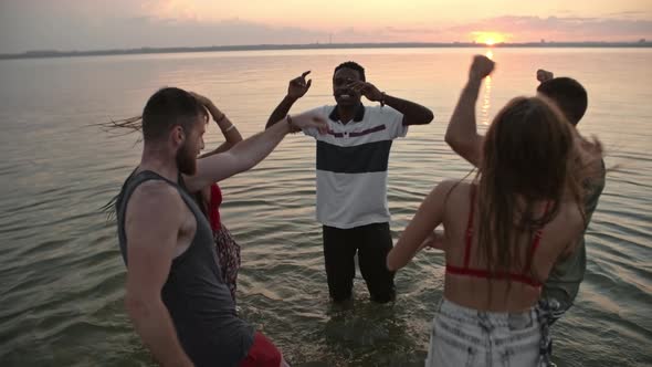 Young Friends Partying in Lake