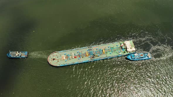 Tugboat Pulling Heavy Loaded Barge.