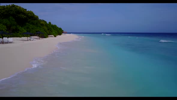 Aerial drone view travel of tropical coast beach holiday by blue green lagoon with white sandy backg