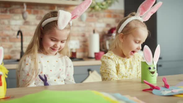 Video of happy two girls have fun with Easter puppets. Shot with RED helium camera in 8K.