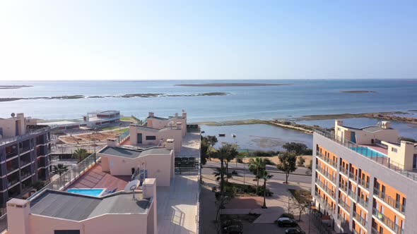 Aerial View of the Urban Area of Portugal in the South of Houses with Modern Infrastructure Swimming