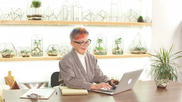 Portait of Modern and Attractive Senior Businesswoman Working on Laptop