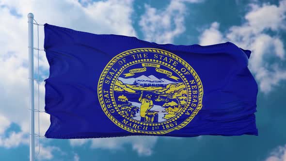 Flag of Nebraska State Region of the United States Waving at Wind