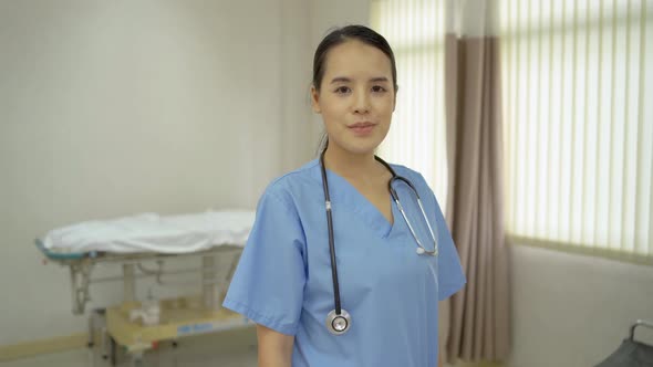 Cheerful young asian female medical nurse healthcare standing and their thumbs up confidently