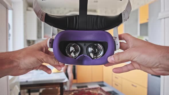 POV Man Taking on VR Helmet at Home Kitchen