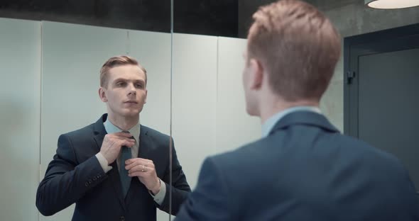 Business Man in Office Bathroom