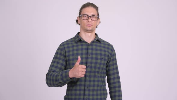 Happy Hipster Man Smiling While Giving Thumbs Up