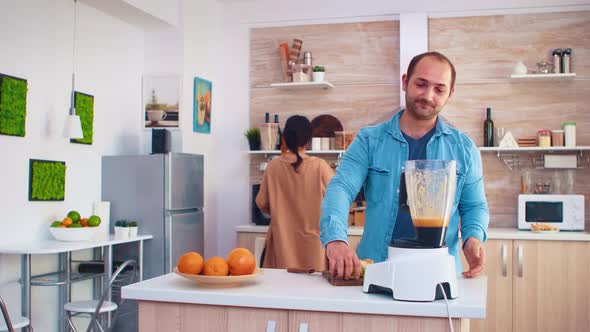 Couple Mixing Various Fruits