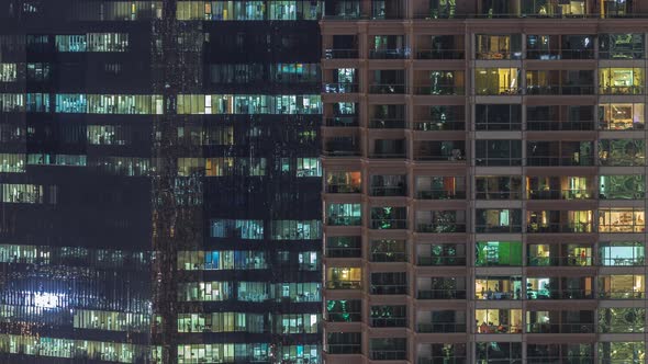 Windows of Apartment and Office Buildings at Night Timelapse the Light From the Windows of Houses