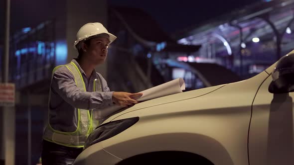 Civil engineer work inspecting architect drawing on construction site