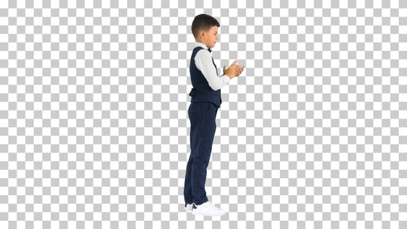Concentrated boy using digital tablet while standing, Alpha Channel