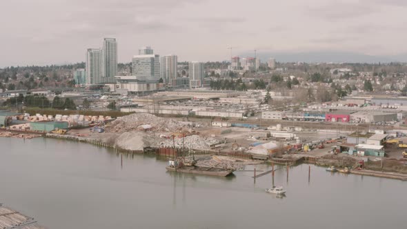 Aerial drone view along the Fraser River in Vancouver, British Columbia.