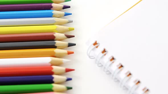 Colored pencils with spiral book