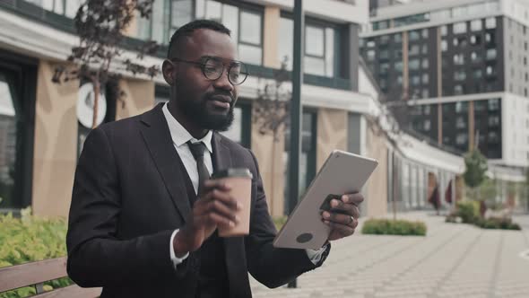 African-American Businessman Talking on Video Call Outside