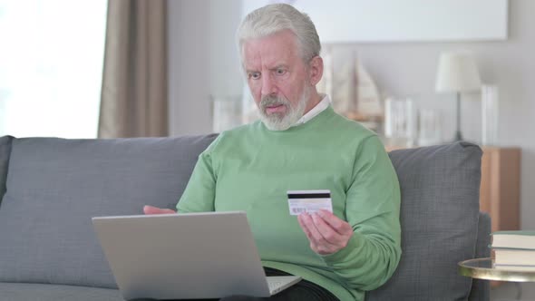 Old Man with Online Payment Failure on Laptop