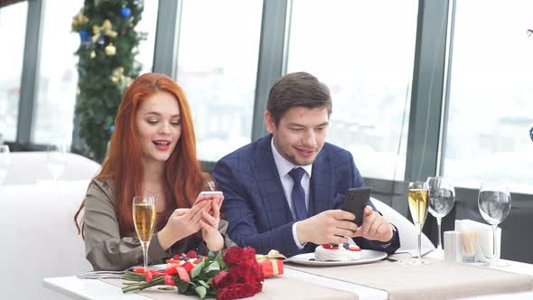 Young European Couple Dines in a Modern Restaurant.