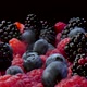Fruits falling down. Plate full of blueberries, blackberries and raspberries on a black background - VideoHive Item for Sale