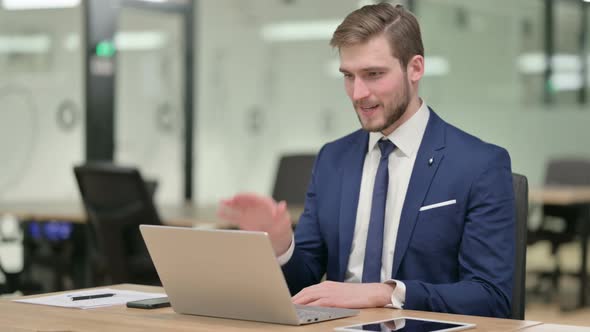 Businessman Talking on Video Call on Laptop