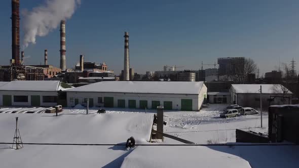 Aerial view of a drone flying over an industrial plant